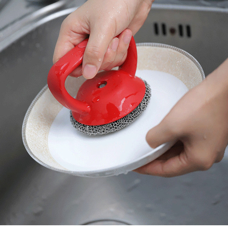 Person using 316 Stainless Steel Cast Iron Scrubber with Handle to clean a plate in a sink.